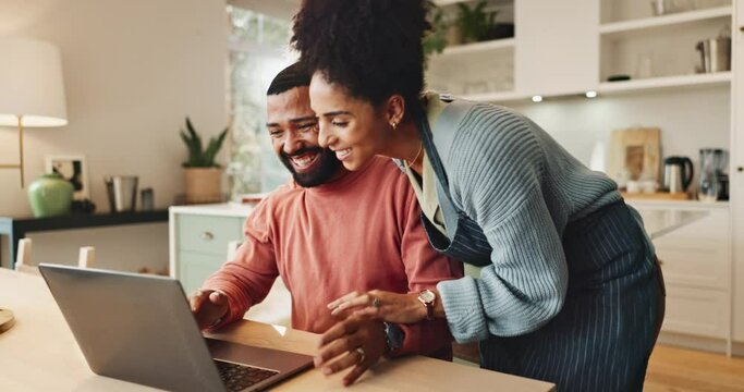 Couple, celebration and laptop for results of lottery, winner and happiness in kitchen and excited. Home, yes and cheer for success, notification and computer for victory, man and woman together
