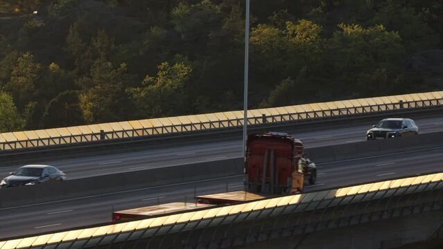 Stockholm, Sweden Traffic at sunset on the Essingeleden and E4 elevated highway in the Grondal district. 