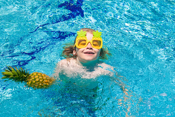 Child in swimming pool. Summer kids activity. Healthy lifestyle.