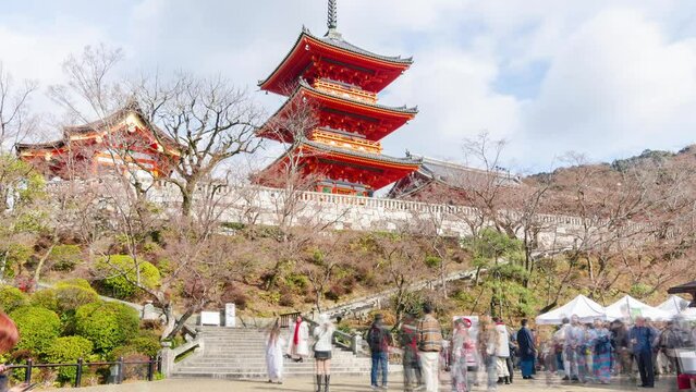 timelapse view at pathway in Kiyomizu dera famous tourist attraction temple with red pagoda in Kyoto world heritage with crowded tourist people
