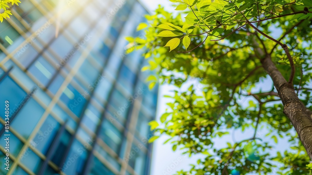 Aufkleber selective focus on tree and eco friendly building with vertical garden in modern city green tree for