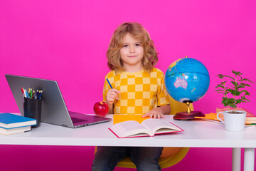 School child. Kid boy from elementary school. Pupil go study. Clever schoolboy learning isolated on pink red studio background. Kids study, knowledge and education.