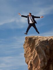 Obraz premium businessman concept of balance and the balancing act of working in a commercial environment. Balanced lifestyle leads to commercial executive success. High altitude views.