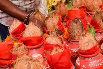 Kalash with coconut and mango leaf with floral decoration earthen pots containing sacred water....