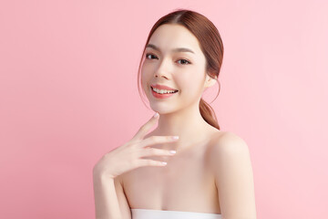 Naklejka premium Beautiful young asian woman with clean fresh skin on pink background, Face care, Facial treatment, Cosmetology, beauty and spa, Asian women portrait.