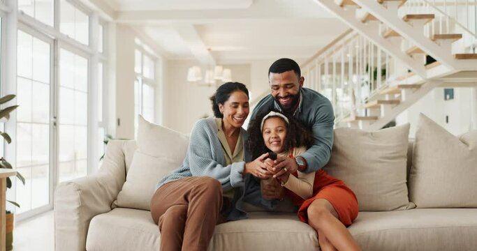 Having fun, running and television with family on sofa in living room of home together for streaming. Energy, funny or laughing with mom, dad and daughter watching tv in apartment for entertainment