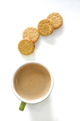 a cup of cappuccino and biscuit