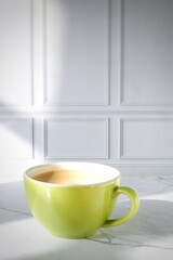 a cup of cappuccino on the table