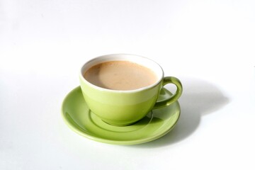 A cup of hot cappuccino isolated on white