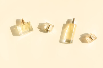 Perfume bottle on beige background, Glass bottle of perfumery