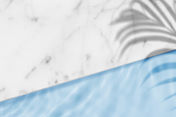 Swimming pool top view background with palm leaves shadow on marble table top and blue water ring waves,Backdrop banner of Summer tropical background for cosmetics product placement podium mockup