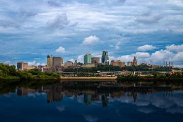 Kansas City Skyline with dramatic Sky and glass water reflection