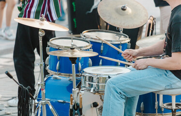 A musician plays a drum set