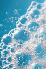 Lush white foam on a blue background, the structure of soap bubbles. Abstract background.