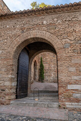 The entrance arch to the ancient Alcazaba in Malaga, Spain