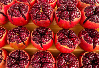 The first juicy pomegranate as a background