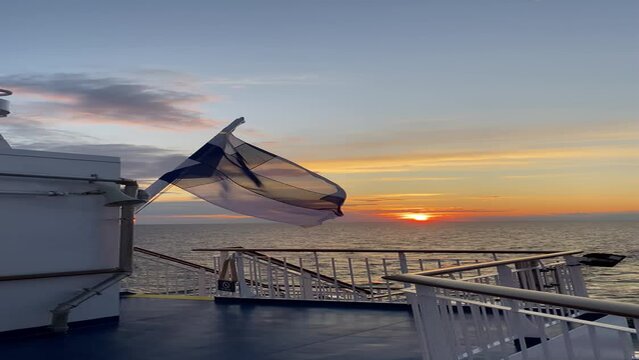 Finland flag waving on the wind in the sea
