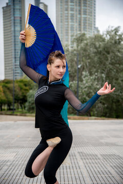 Woman doing oriental dance with fan