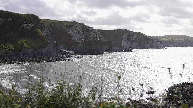 Dinas Head, Dinas Island, Wales UK. Scenic Coastline, Bay and Beach on Sunny Day