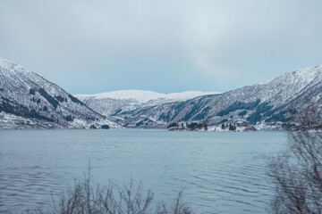 Obraz premium Fjord in norway close to voss. Typical winter wonderland in norwegian countryside. Cloudy day in february.
