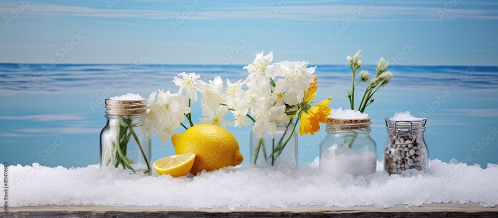 Aufkleber on the table there are three banks containing sea salt and flowers creating a copy space image