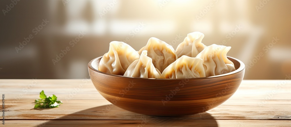 Poster a delicious bowl of dumplings sits on a wooden table with ample copy space for the image