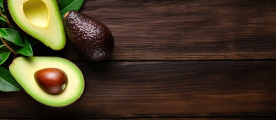 Top view of a healthy food concept with an avocado on a wooden board creating a visually appealing copy space image