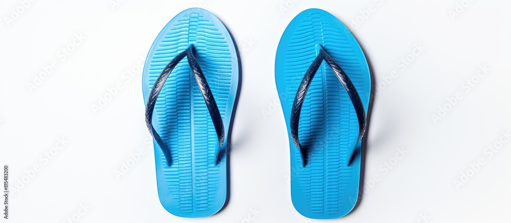 Aufkleber a top view of blue flip flops against a white background with plenty of empty space in the image. cr