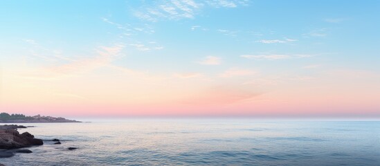 Obraz premium Picturesque coastline with a serene ambiance at dawn featuring an empty expanse and ample copy space image