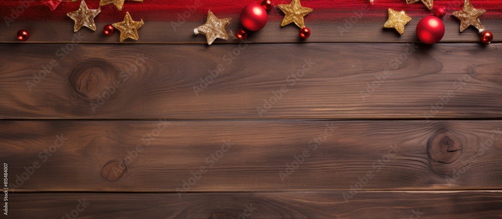Poster top view of a christmas themed red wooden background adorned with festive decorations offers ample c