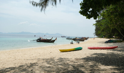Fototapeta premium Beach on Koh Kradan Island in the Andaman Sea. Seafarers and tour boats and island scenery.