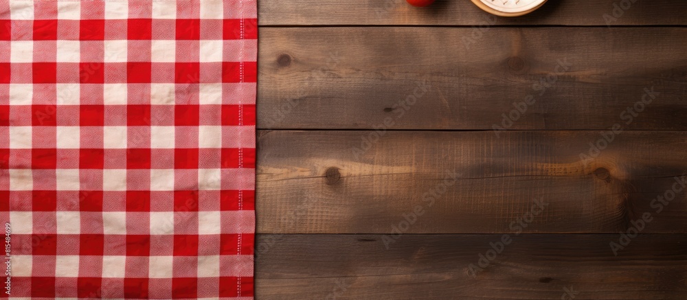 Leinwandbilder Top view of a wooden background with an empty cutting board and a tablecloth providing ample copy space for an image
