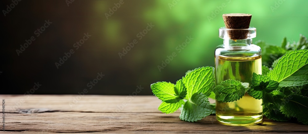 Aufkleber a bottle of refreshing essential oil and fresh mint placed on a rustic wooden table with plenty of r