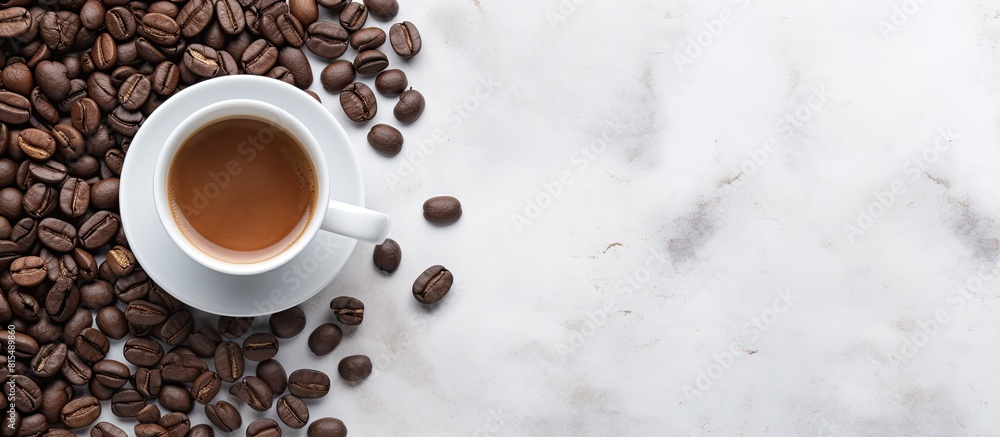 Poster a top down view of a white cup filled with black coffee and coffee beans placed on a gray stone back