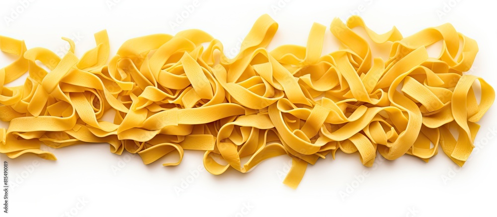 Aufkleber Top view of a close up image showing a heap of raw pasta as an isolated copy space image on a white background representing Italian food or cuisine