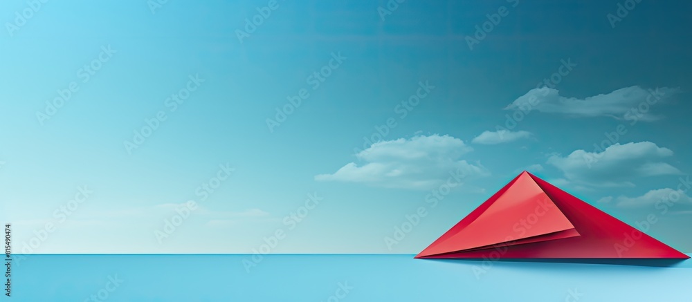 Poster a panoramic shot captures a leadership concept with a top view of a red paper plane on a blue backgr