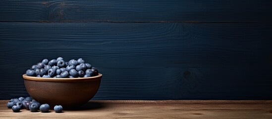 A rustic country table showcases a captivating image of a blueberry nestled in a bowl leaving ample copy space for creative use