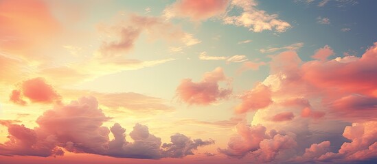 Fototapeta premium A vibrant sunset sky with clouds in various colors creating a vintage style background scene Perfect for copy space images 136 characters