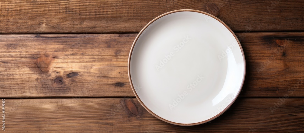 Aufkleber Top view of an empty plate displayed on a wooden surface with ample copy space for images