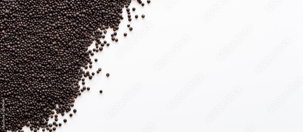 Poster Top view of black quinoa seeds on a white background with ample space for your text in the image