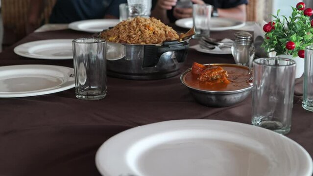 Serving Chinese food on the table.