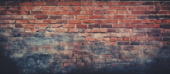 A vintage toned styled background with a vignette effect featuring a brick wall for texture and copy space image