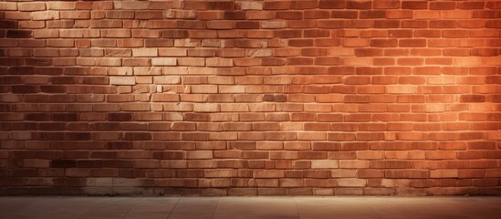 A textured red brick wall with light and shadow creating an abstract background This copy space...