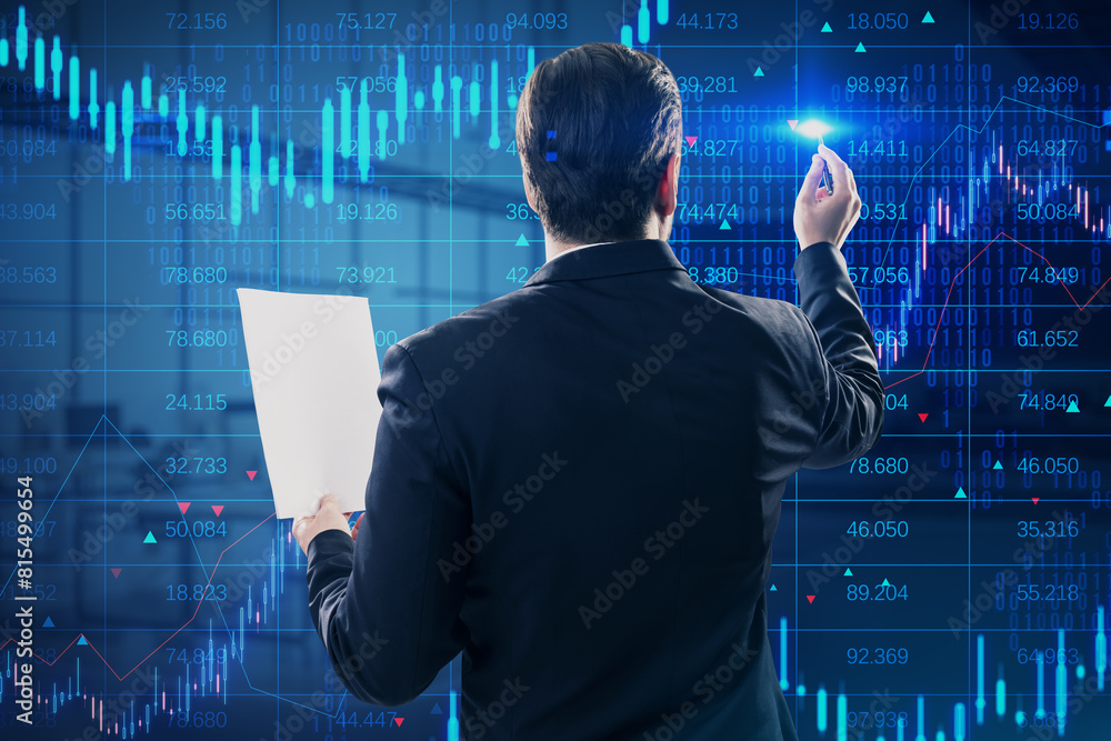 Poster back view of attractive young european businessman with paperwork and creative candlestick forex cha