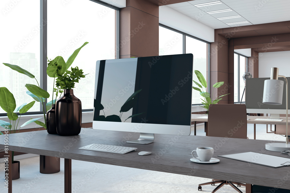 Poster close up of workplace with computer monitor and reflections in modern brown coworking office interio