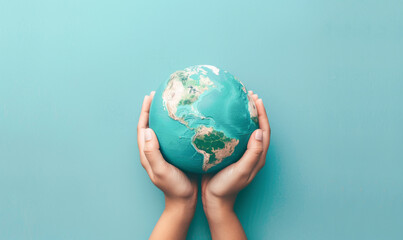 A person is holding a globe in their hands