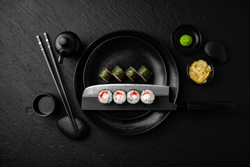 Shrimp and tobiko maki. Sushi composition on black background. The Art of Japanese Cuisine. Food...