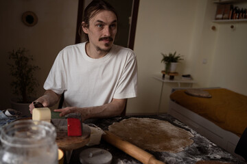 Man making pizza at home