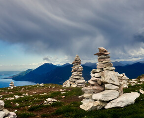 Meditative Stone Cairns on a Mountain Summit in the Italian Alps