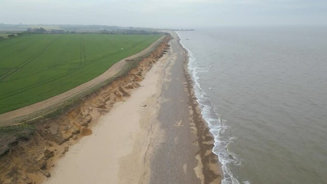 Forward aerial shot of Kessingland Beach on a beautiful day in Suffolk, England. Drone view.